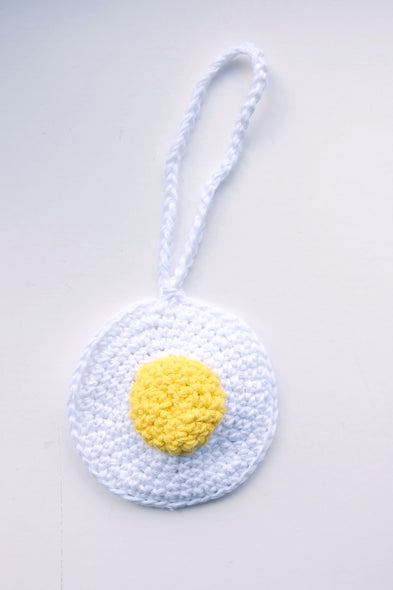 Hand crocheted charm. Sunny side up