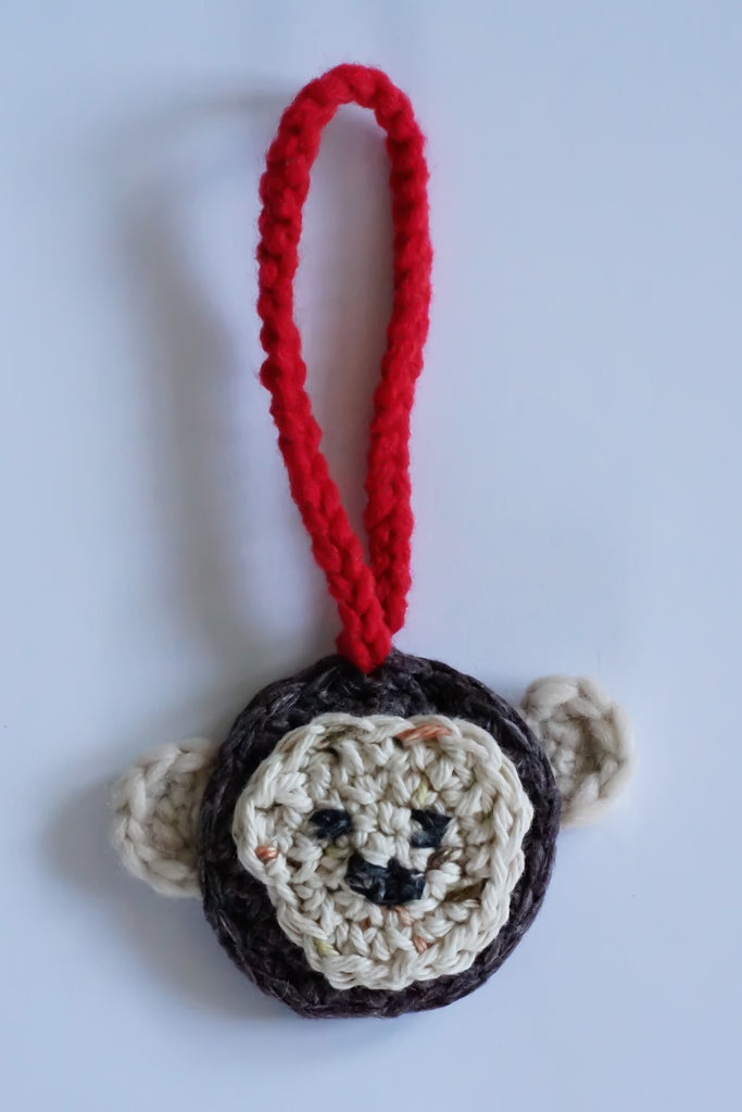 Hand crocheted charm. Monkey